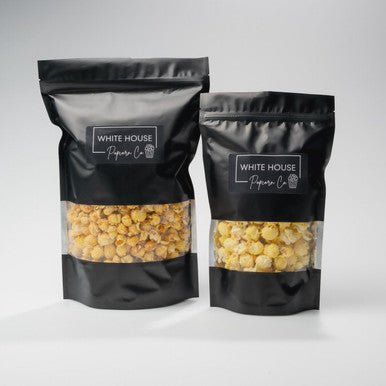Chocolate Peanut Butter Popcorn available at Whitehousepopcorn.com. Resealable black popcorn bag with window.